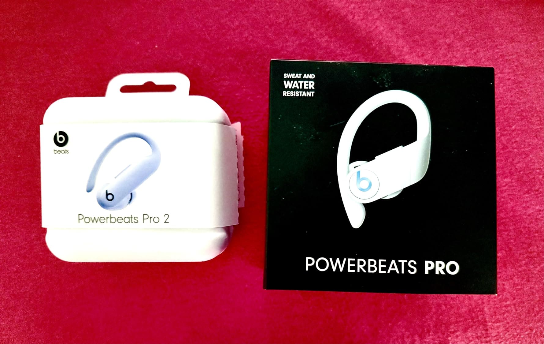 Beats Powerbeats Pro 2 earbuds in Quick Sand color with secure-fit earhooks.