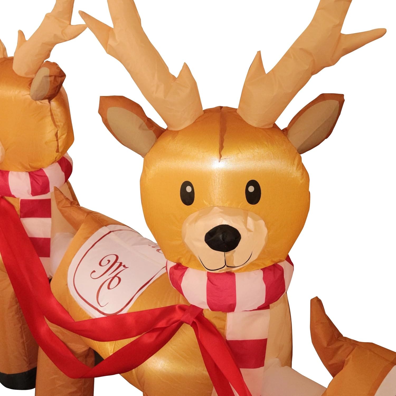 Kids enjoying Mariah Carey Christmas lawn decoration