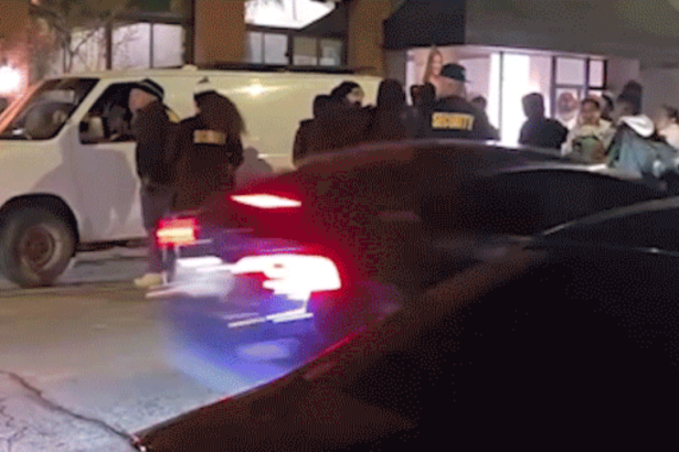 car driving through crowd
